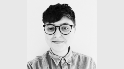 Liz, a person with short hair and glasses